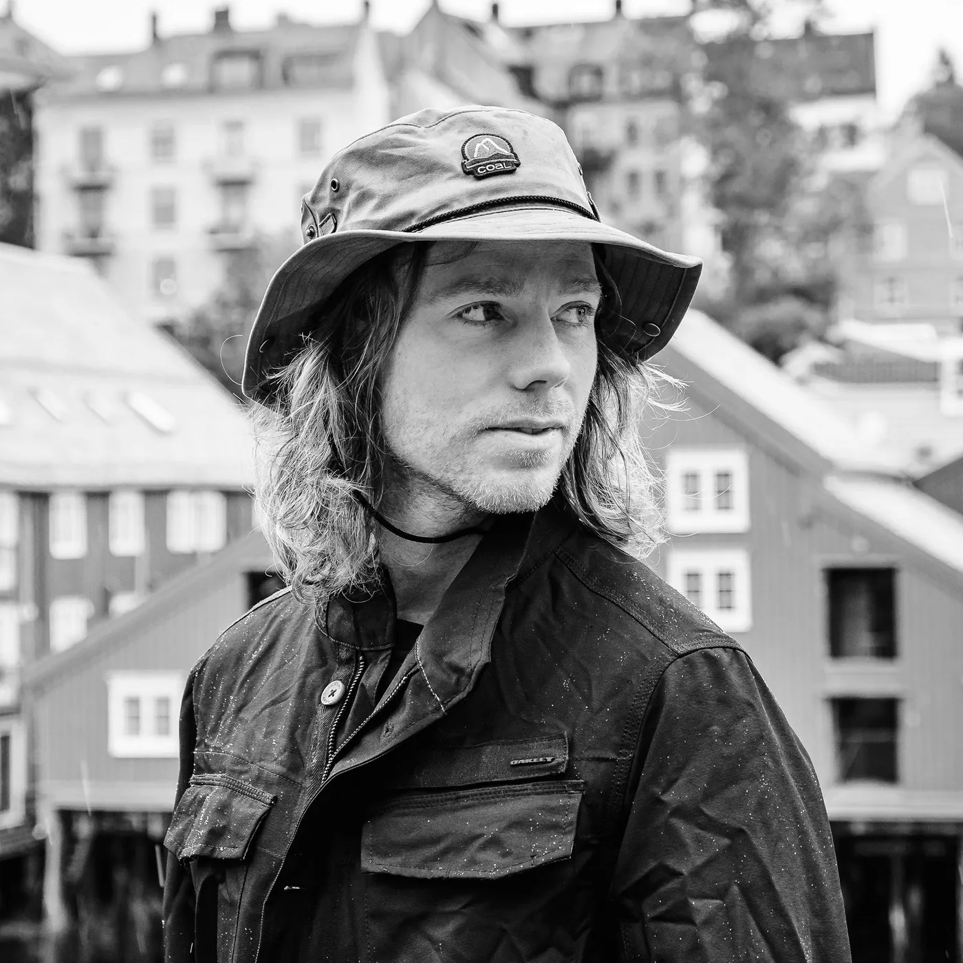 Black and white portrait of Torstein Horgmo in a Coal bucket hat