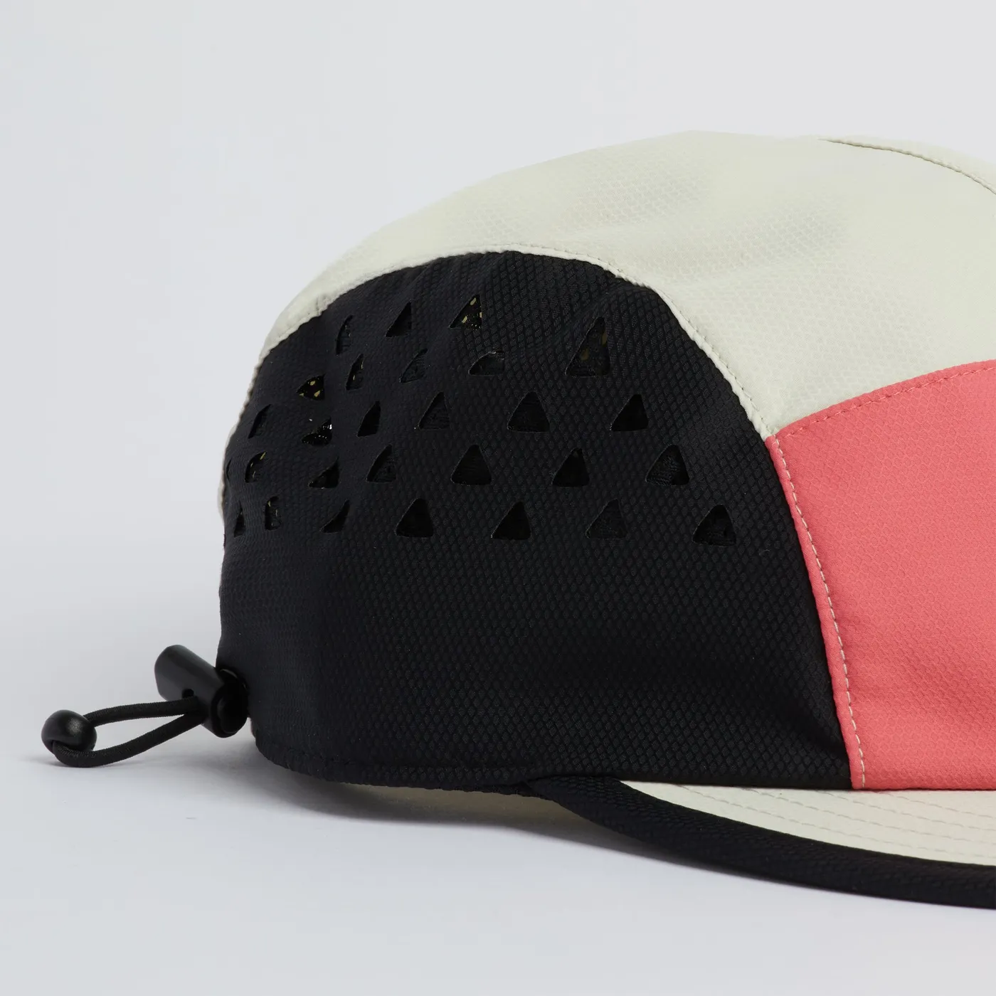 Side of the Provo cap showing the laser-cut perforations and the shock cord