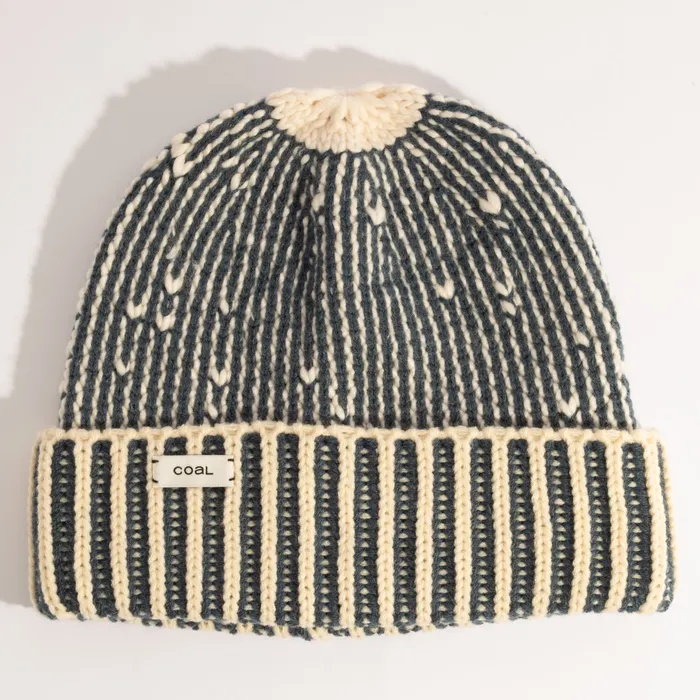 The Moraine Ribbed Beanie in striped navy and bone